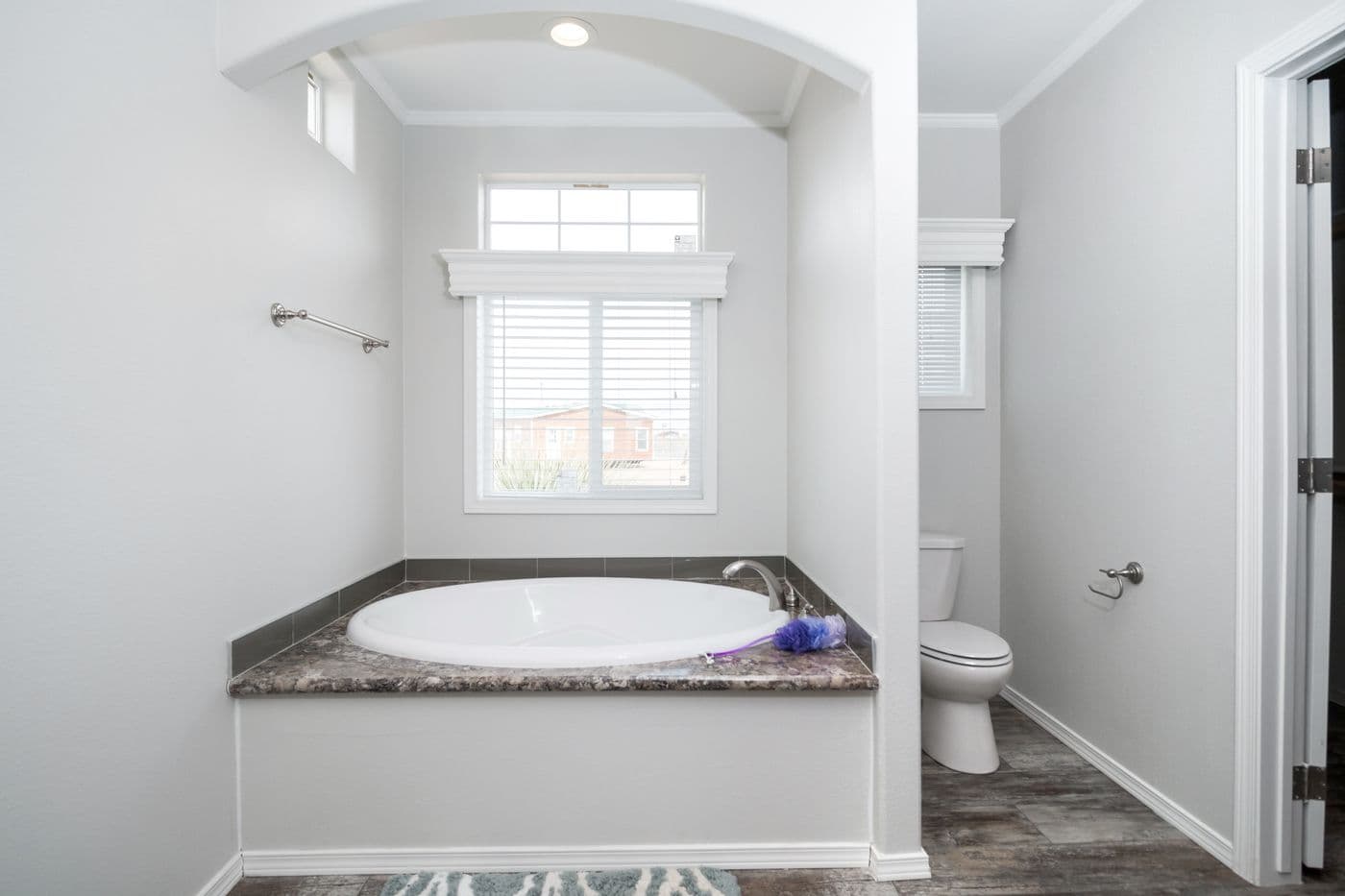 The ENCHANTMENT 3070A Primary Bathroom. This Manufactured Mobile Home features 3 bedrooms and 2 baths.