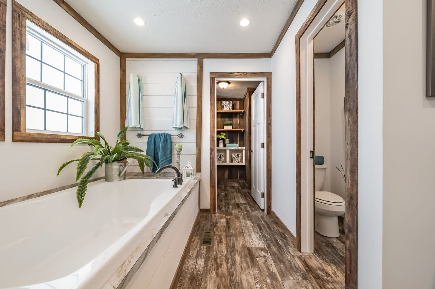The THE EMMA JEAN Primary Bathroom. This Manufactured Mobile Home features 4 bedrooms and 3 baths.