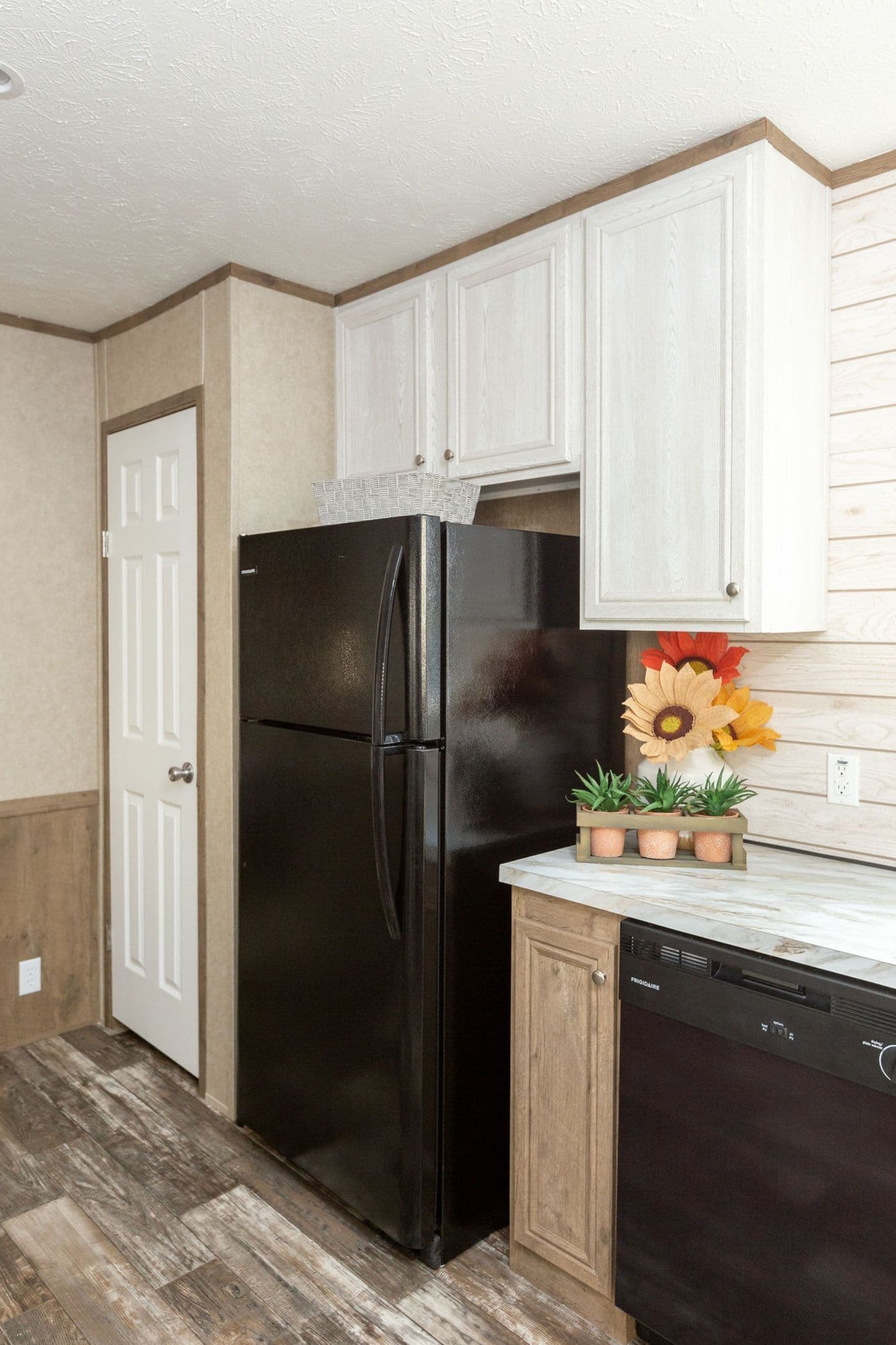 The THE RANCH HOUSE Kitchen. This Manufactured Mobile Home features 3 bedrooms and 2 baths.
