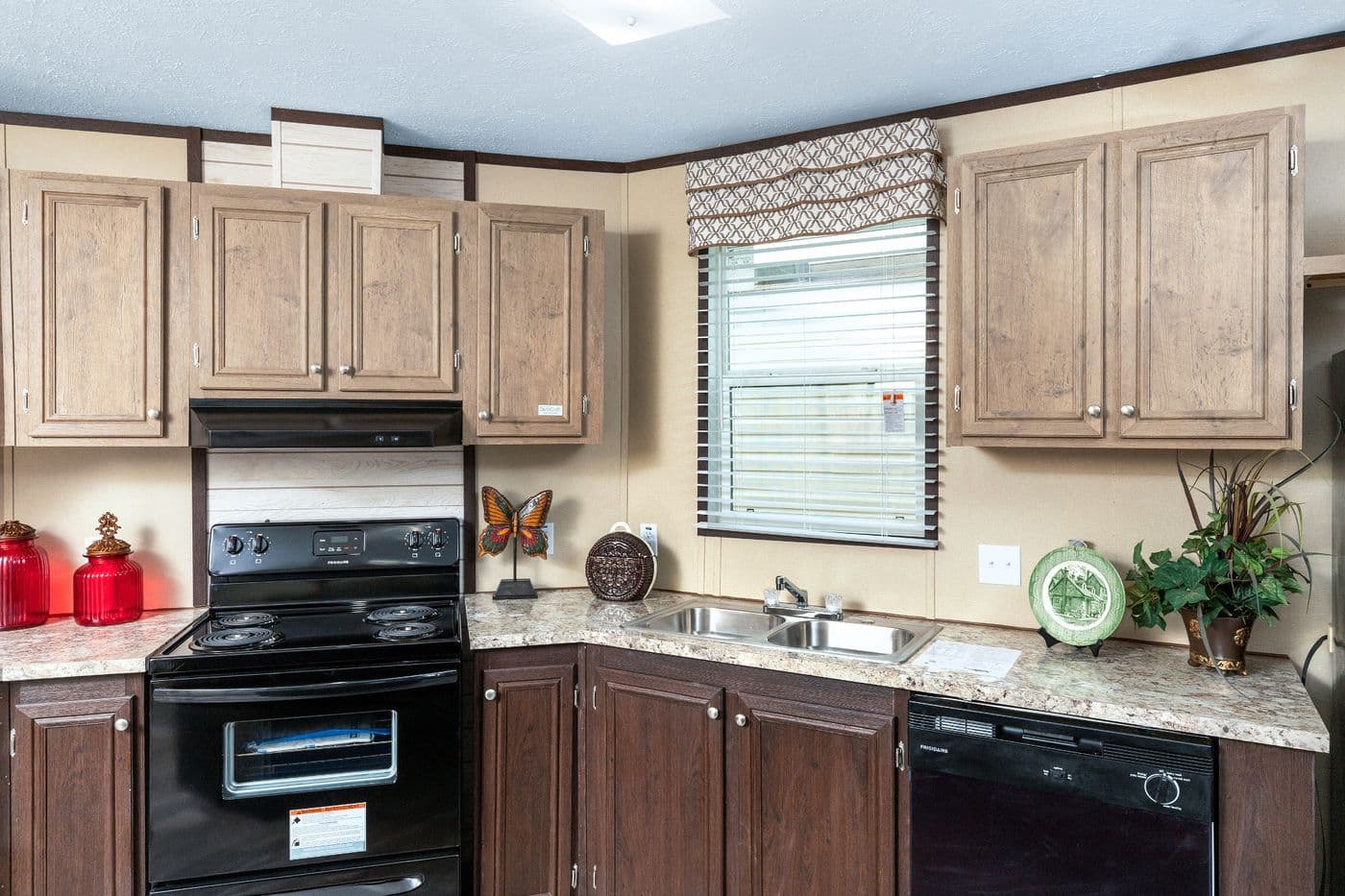 The THE SHERMAN Kitchen. This Manufactured Mobile Home features 3 bedrooms and 2 baths.
