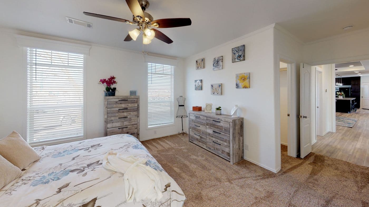 The SUM3068A Primary Bedroom. This Manufactured Mobile Home features 3 bedrooms and 2 baths.
