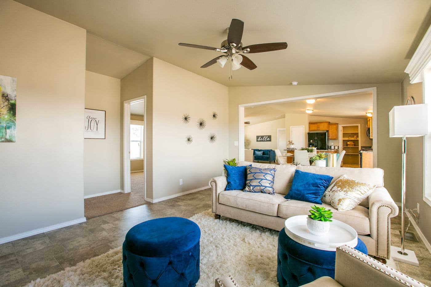 The THE WAVE Living Room. This Manufactured Mobile Home features 4 bedrooms and 2 baths.
