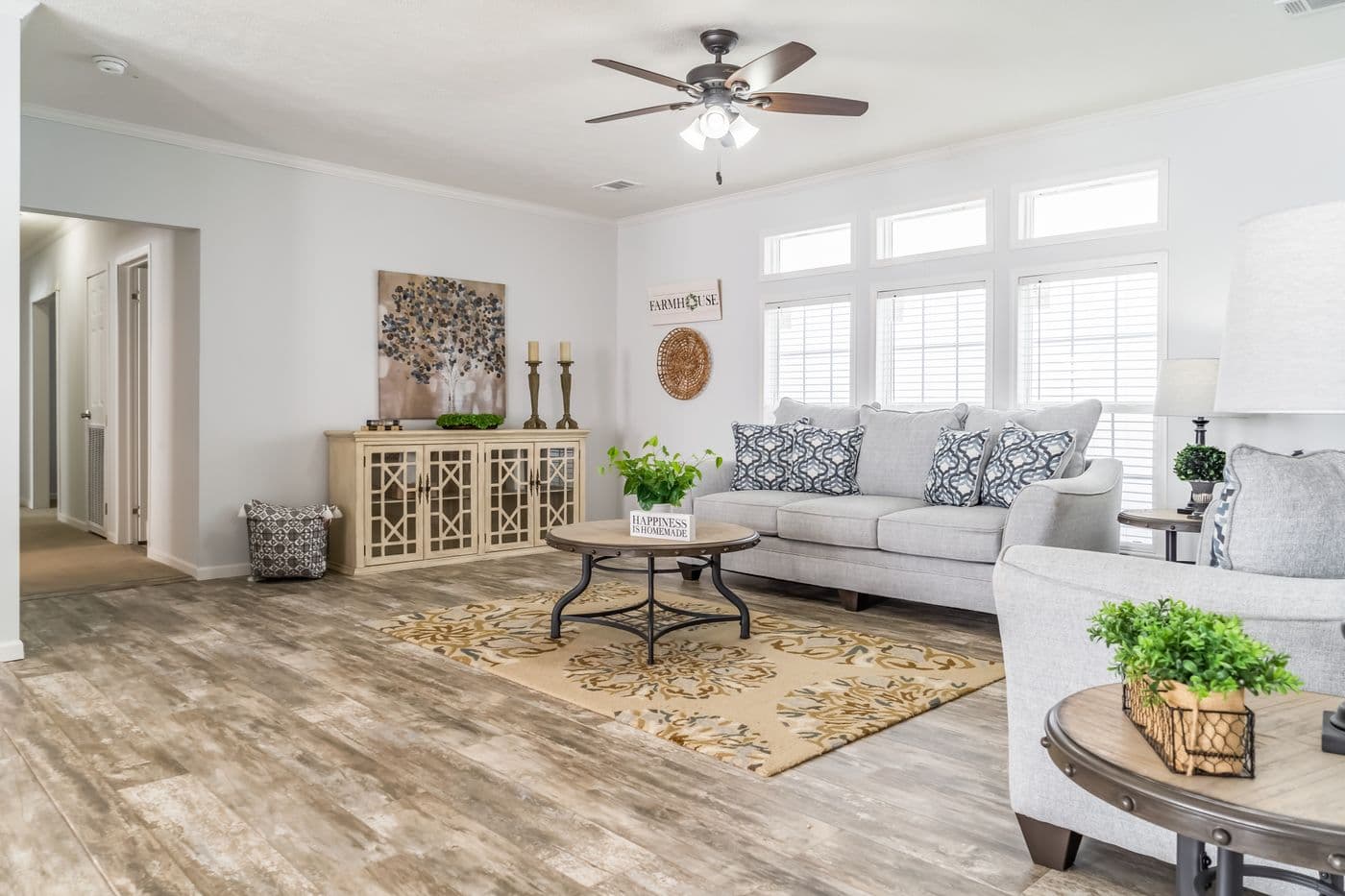 The THE INGRAM Living Room. This Manufactured Mobile Home features 3 bedrooms and 2 baths.