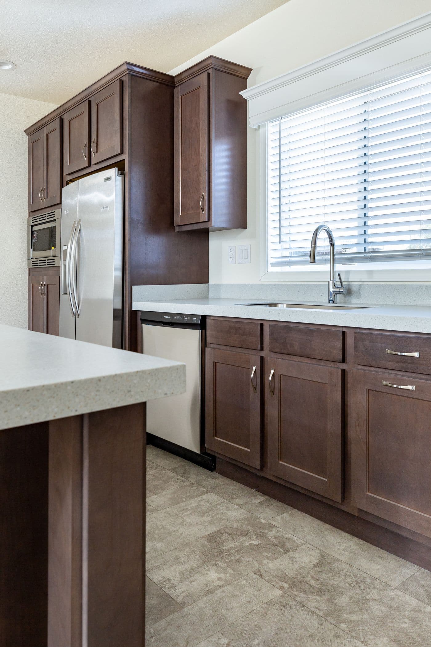 The CORONADO 2446A Kitchen. This Manufactured Mobile Home features 3 bedrooms and 2 baths.
