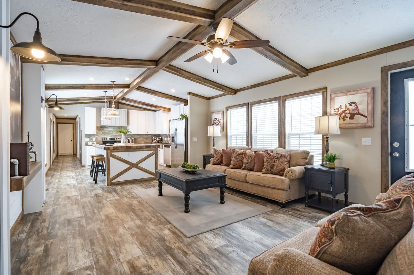 The THE BOBBY JO Living Room. This Manufactured Mobile Home features 3 bedrooms and 2 baths.