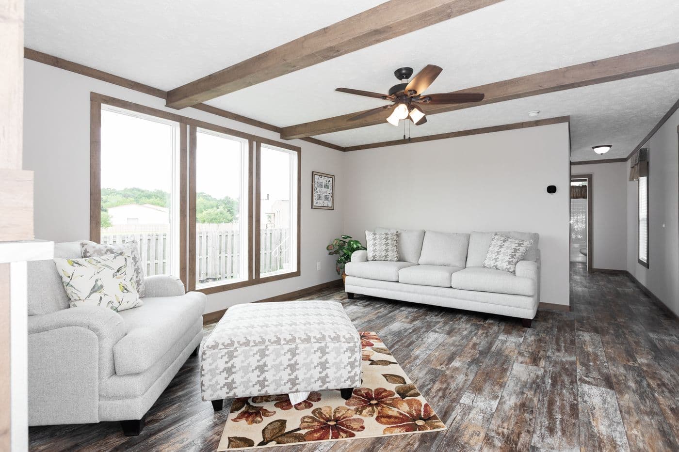 The THE WALSH Living Room. This Manufactured Mobile Home features 3 bedrooms and 2 baths.
