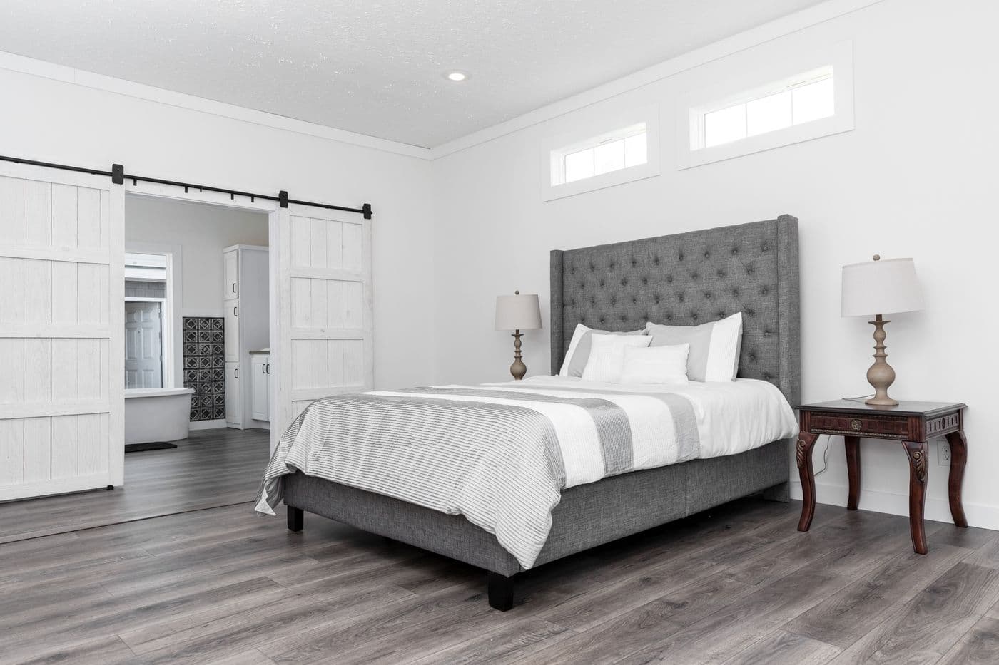 The 1440 CAROLINA 4BR BELLE Primary Bedroom. This Manufactured Mobile Home features 4 bedrooms and 2 baths.