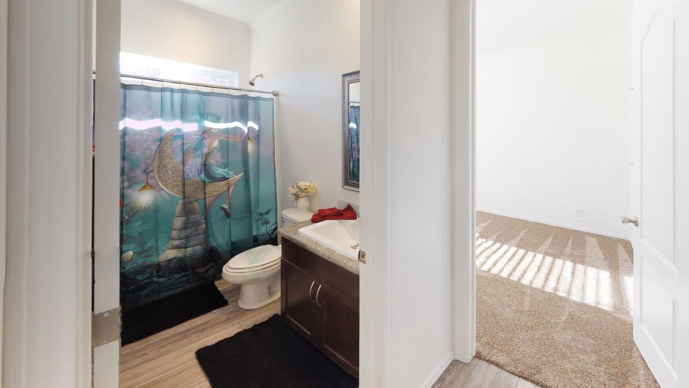 The SUM3068A Guest Bathroom. This Manufactured Mobile Home features 3 bedrooms and 2 baths.