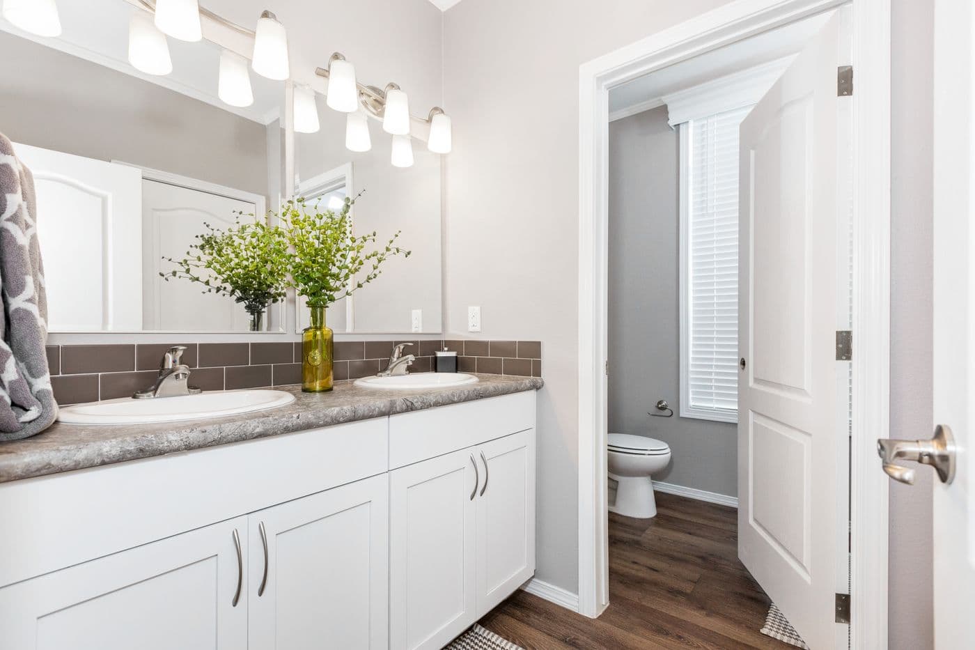 The ENCHANTMENT 3070A Primary Bathroom. This Manufactured Mobile Home features 3 bedrooms and 2 baths.