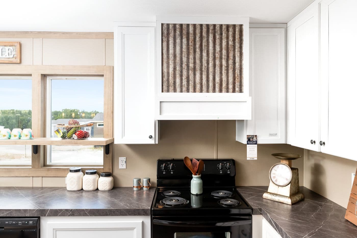 The FARMHOUSE FLEX Kitchen. This Manufactured Mobile Home features 3 bedrooms and 2.5 baths.