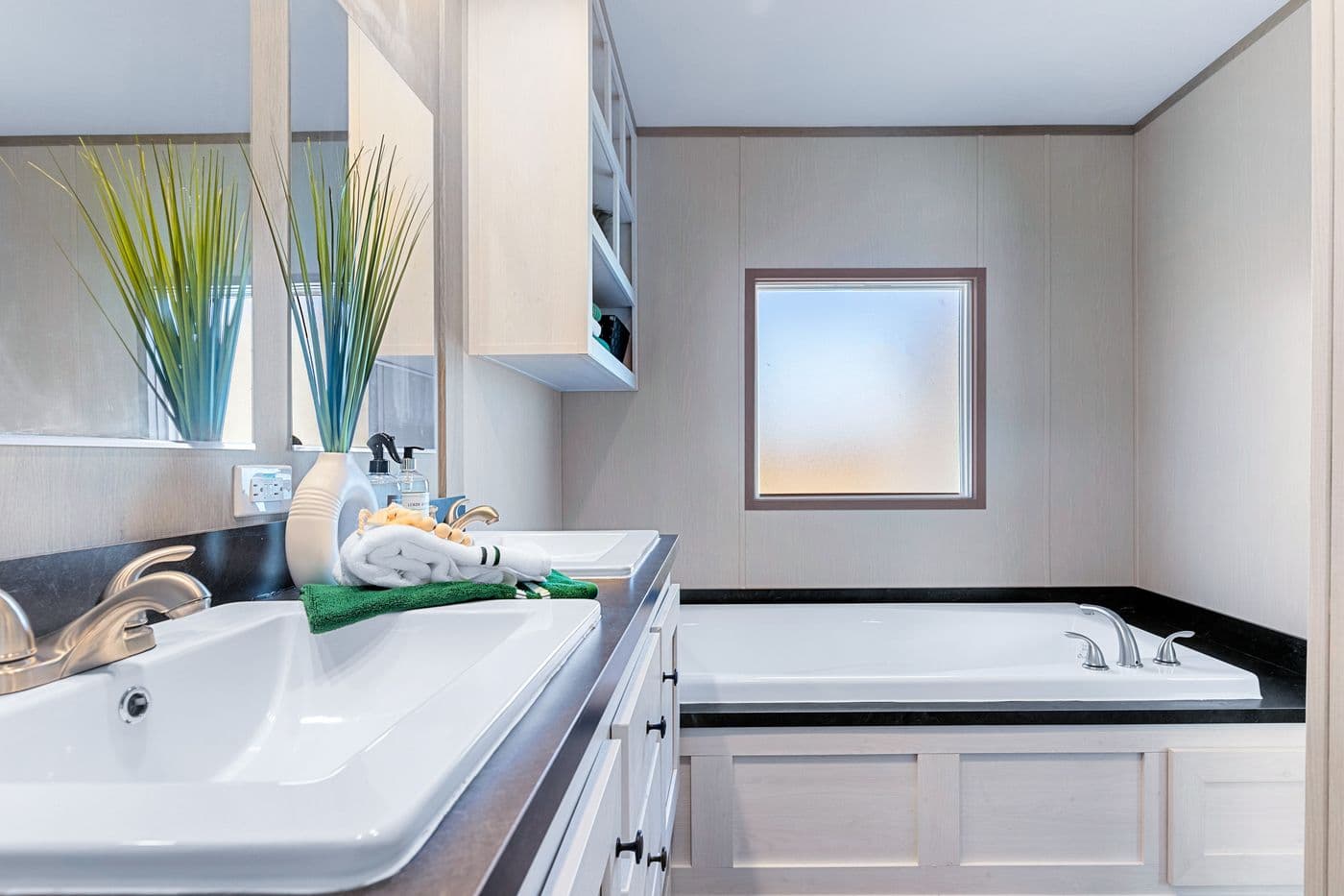 The ANNIVERSARY 16763I Primary Bathroom. This Manufactured Mobile Home features 3 bedrooms and 2 baths.