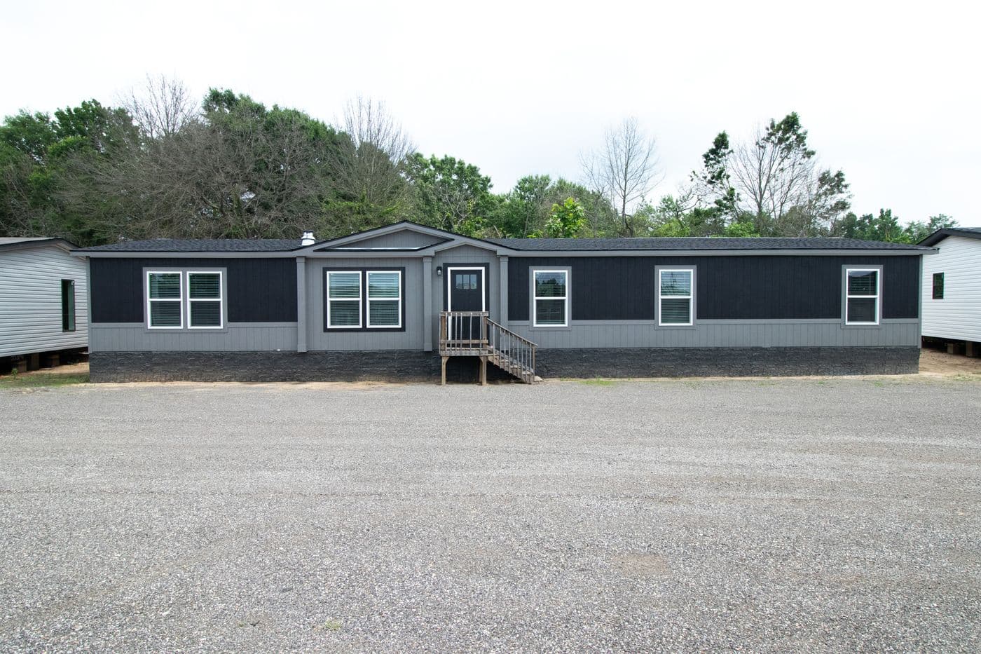 The ABSOLUTE VALUE Exterior. This Manufactured Mobile Home features 4 bedrooms and 2 baths.