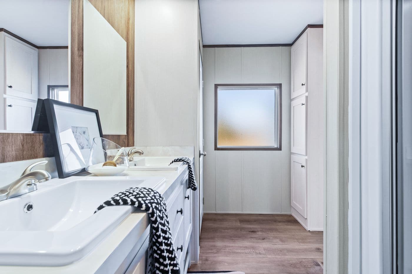 The ANNIVERSARY 16763F Primary Bathroom. This Manufactured Mobile Home features 3 bedrooms and 2 baths.