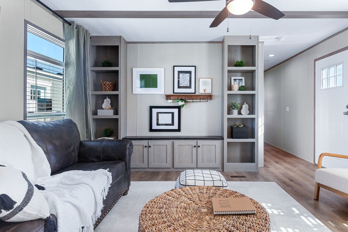The ANNIVERSARY 16763I Living Room. This Manufactured Mobile Home features 3 bedrooms and 2 baths.