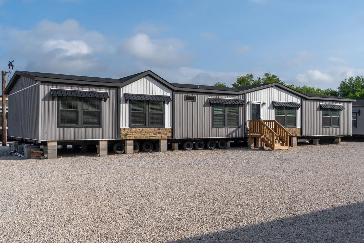 The THE MAGNOLIA Exterior. This Manufactured Mobile Home features 4 bedrooms and 3 baths.