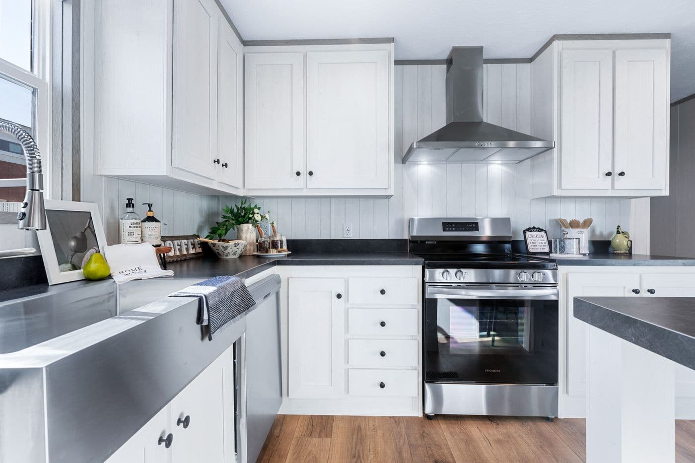 The ANNIVERSARY 16763I Kitchen. This Manufactured Mobile Home features 3 bedrooms and 2 baths.
