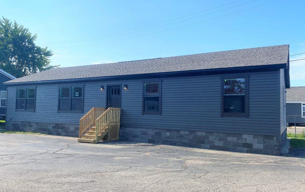 The MICHIGAN AVE/6028-MS026-1 SECT Exterior. This Manufactured Mobile Home features 3 bedrooms and 2 baths.