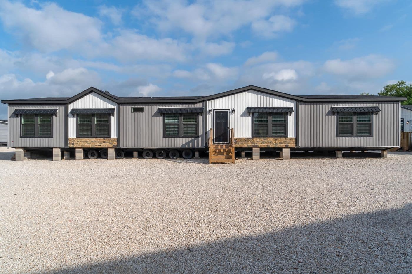 The THE MAGNOLIA Exterior. This Manufactured Mobile Home features 4 bedrooms and 3 baths.
