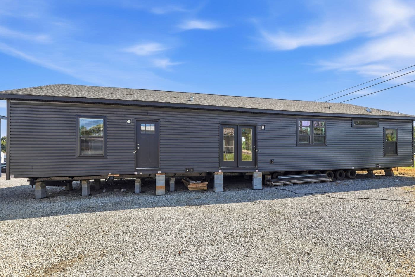 The SUPER 68 ELITE Exterior. This Manufactured Mobile Home features 3 bedrooms and 2 baths.