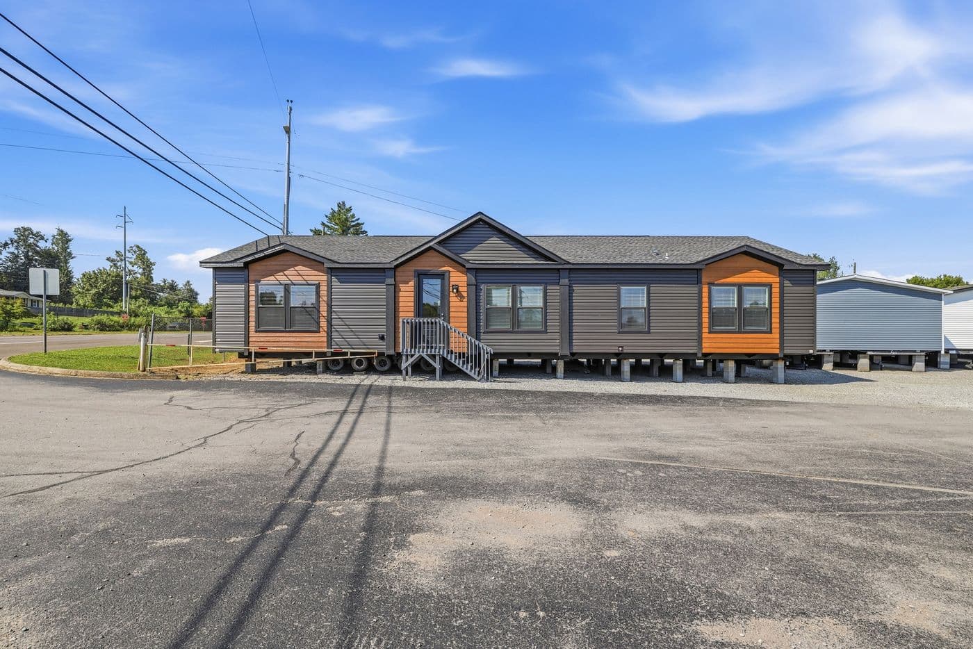 The SUPER 68 ELITE Exterior. This Manufactured Mobile Home features 3 bedrooms and 2 baths.