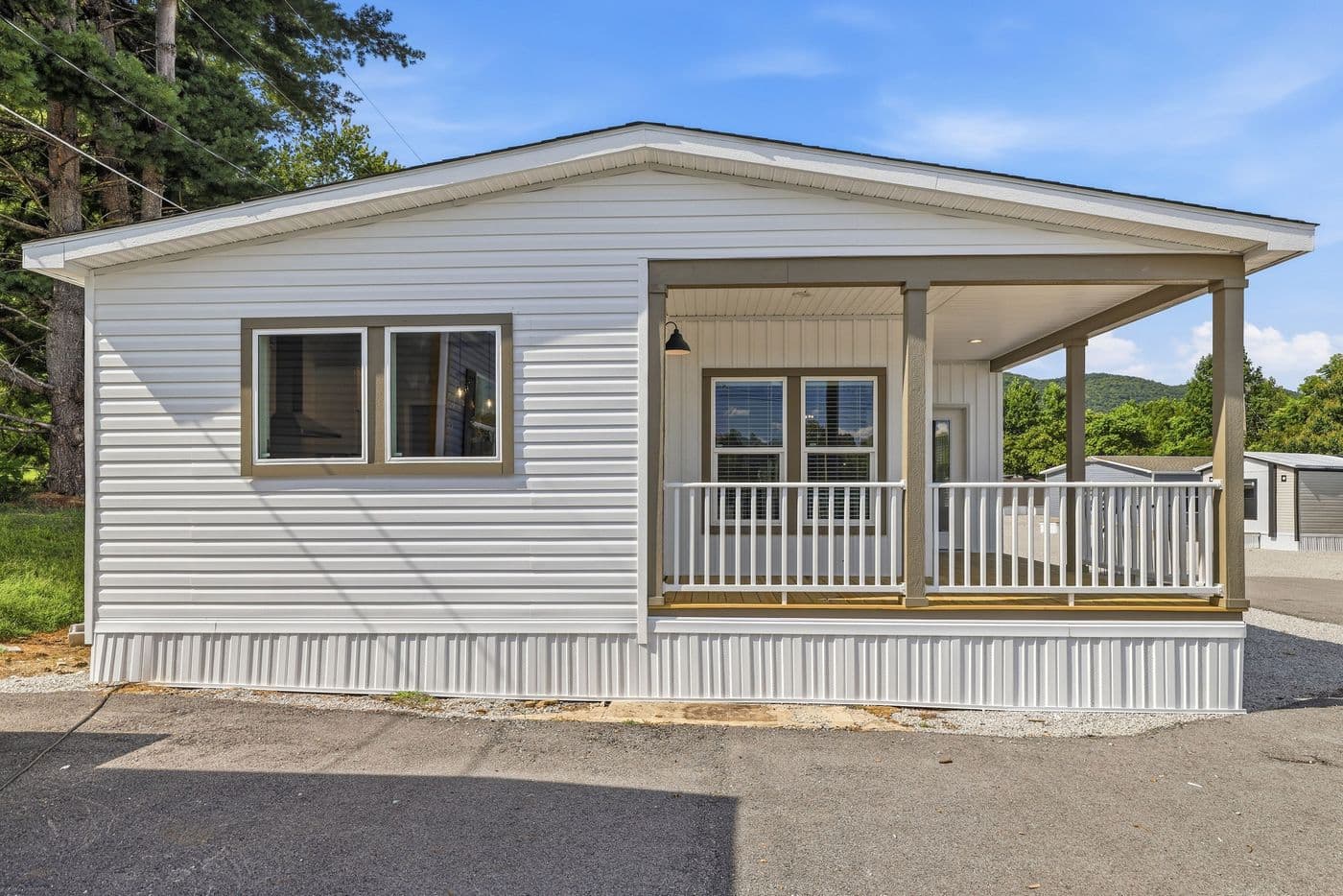 The SOUTHERN CHARM Exterior. This Manufactured Mobile Home features 3 bedrooms and 2 baths.