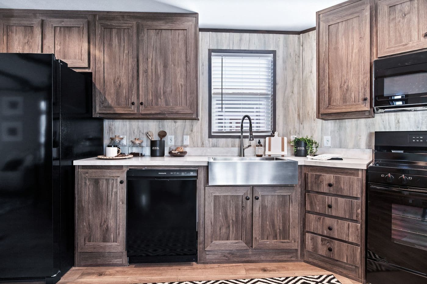 The ANNIVERSARY 16763F Kitchen. This Manufactured Mobile Home features 3 bedrooms and 2 baths.