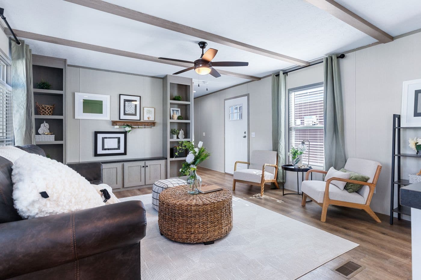 The ANNIVERSARY 16763I Living Room. This Manufactured Mobile Home features 3 bedrooms and 2 baths.