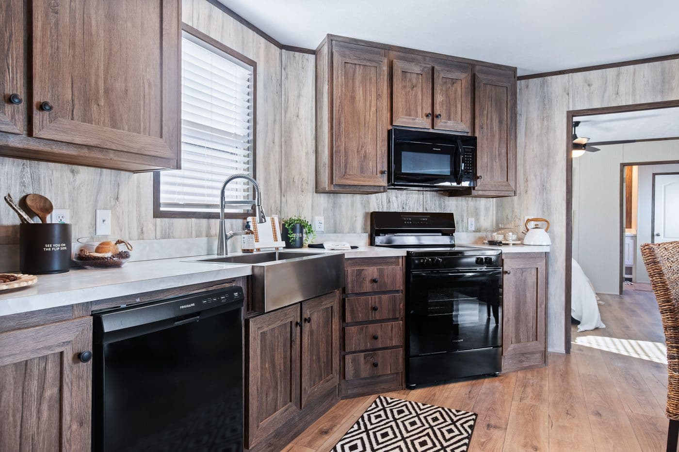 The ANNIVERSARY 16763F Kitchen. This Manufactured Mobile Home features 3 bedrooms and 2 baths.