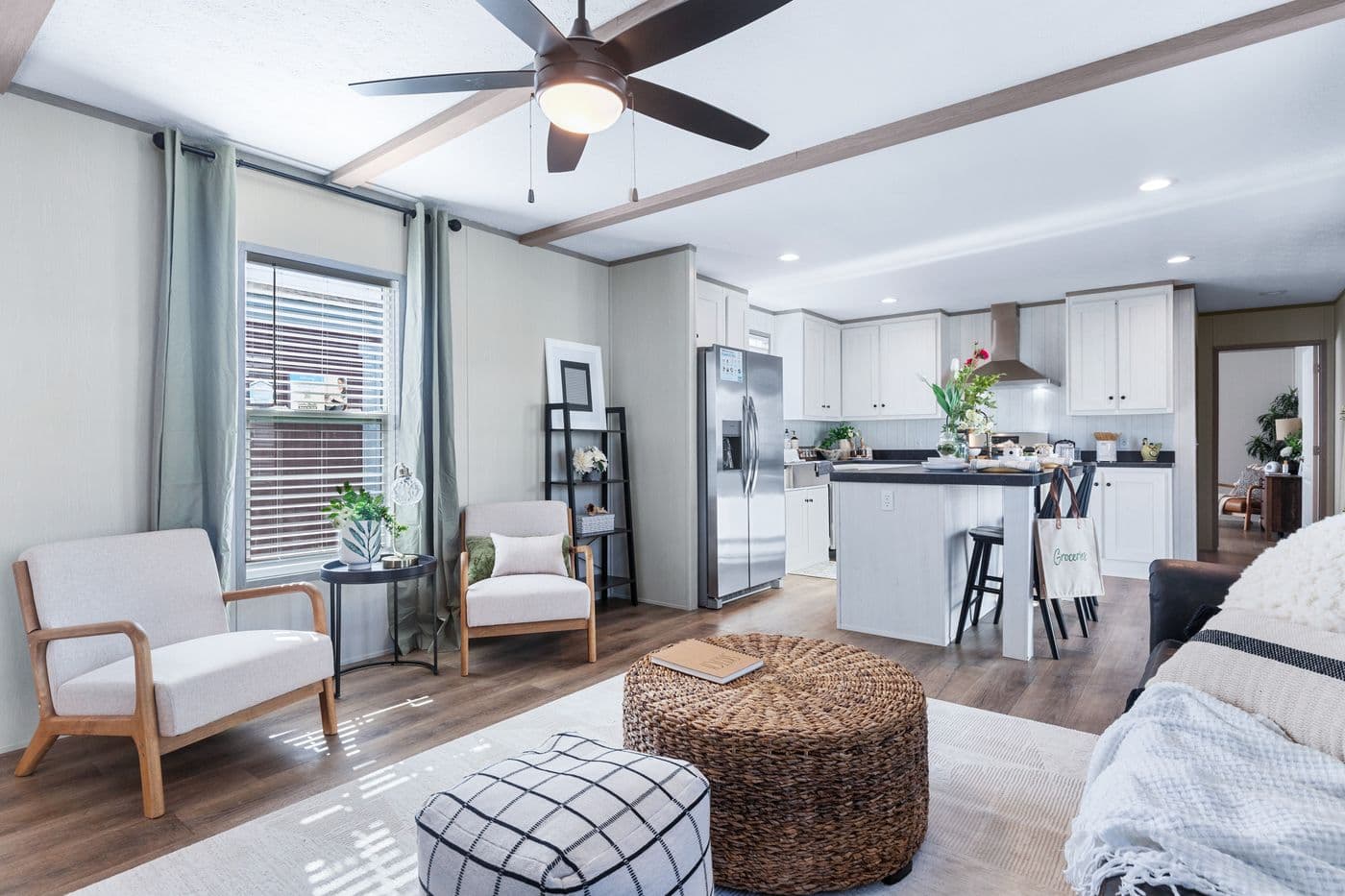 The ANNIVERSARY 16763I Living Room. This Manufactured Mobile Home features 3 bedrooms and 2 baths.