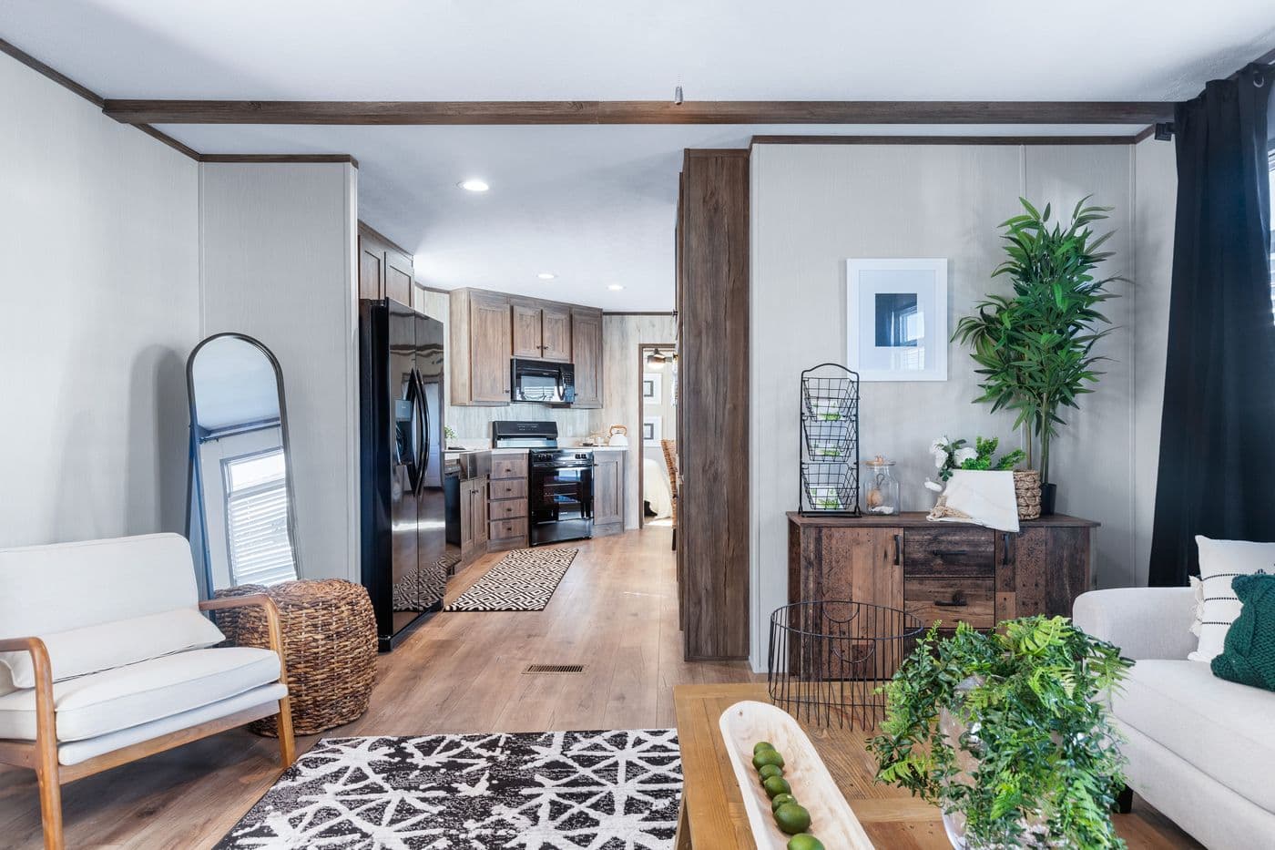 The ANNIVERSARY 16763F Living Room. This Manufactured Mobile Home features 3 bedrooms and 2 baths.