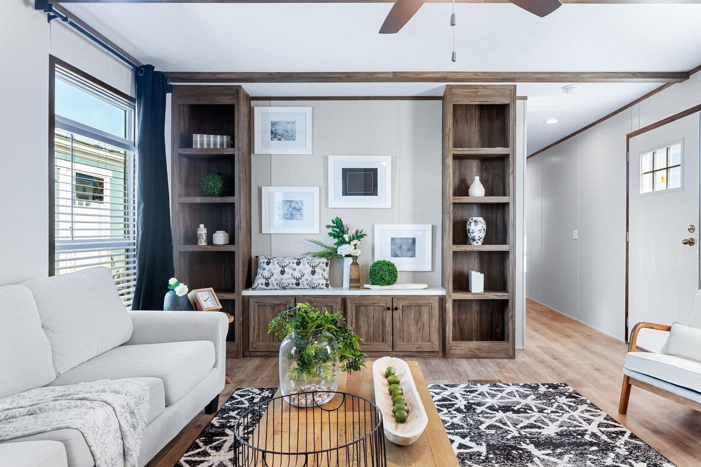 The ANNIVERSARY 16763F Living Room. This Manufactured Mobile Home features 3 bedrooms and 2 baths.