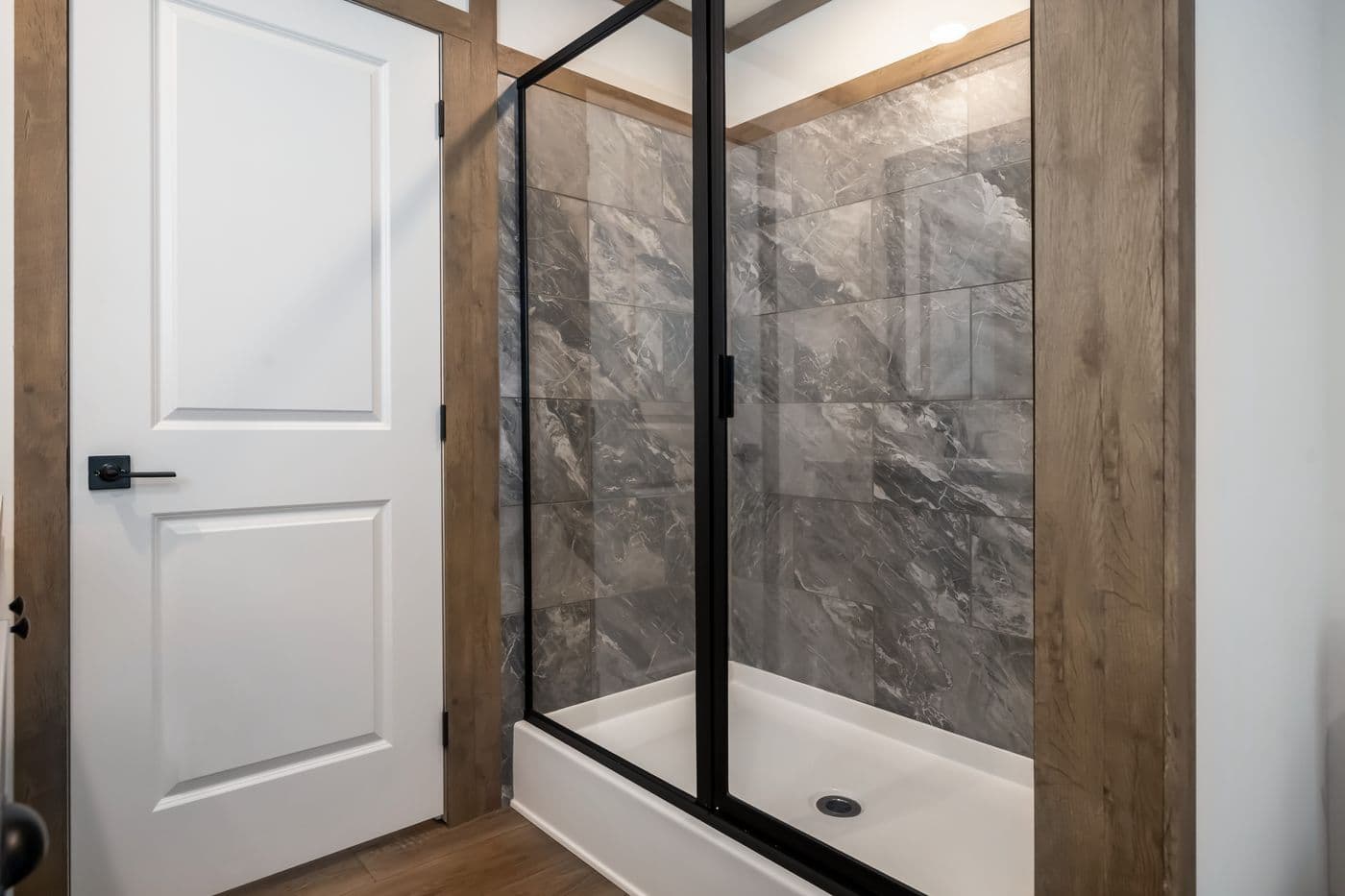 The THE LIZZIE Primary Bathroom. This Manufactured Mobile Home features 3 bedrooms and 2 baths.