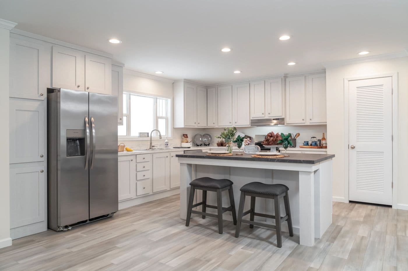 The 4230 "CLEARWATER" 7632 Kitchen. This Manufactured Mobile Home features 4 bedrooms and 2 baths.
