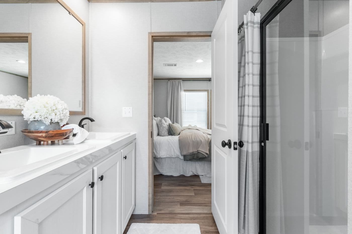 The THE REAL DEAL Primary Bathroom. This Manufactured Mobile Home features 3 bedrooms and 2 baths.