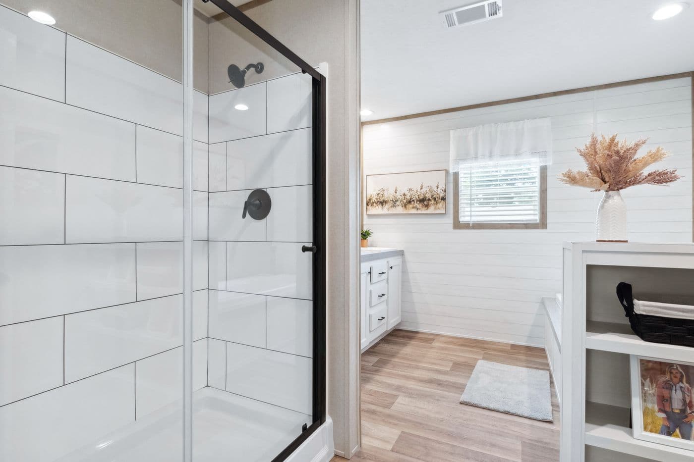 The BREEZE FARMHOUSE 72 Primary Bathroom. This Manufactured Mobile Home features 4 bedrooms and 2 baths.