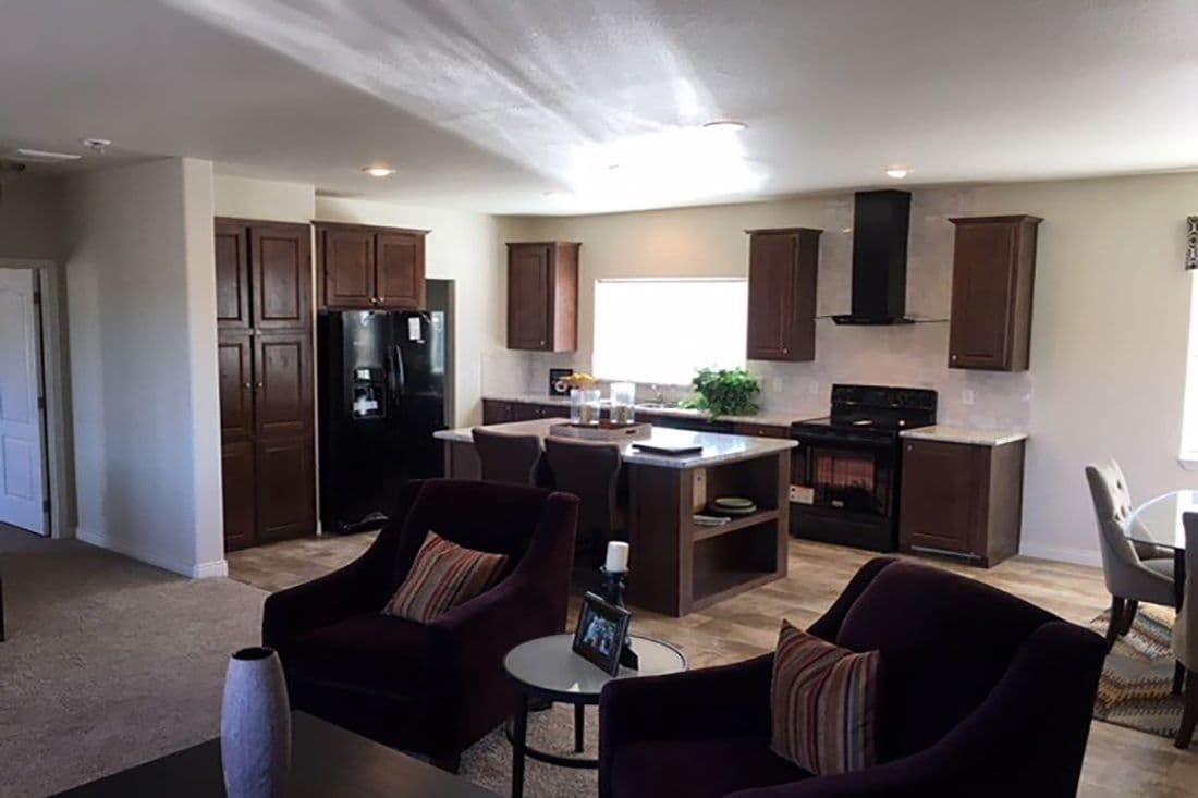 The 2024 COLUMBIA RIVER (NEW) Living Room. This Manufactured Mobile Home features 3 bedrooms and 2 baths.
