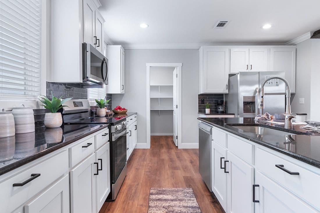 The THE OCEANSIDE Kitchen. This Manufactured Mobile Home features 4 bedrooms and 3 baths.