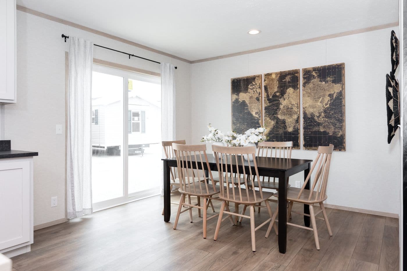 The 6032-5700 THE PULSE Dining Room. This Manufactured Mobile Home features 3 bedrooms and 2 baths.