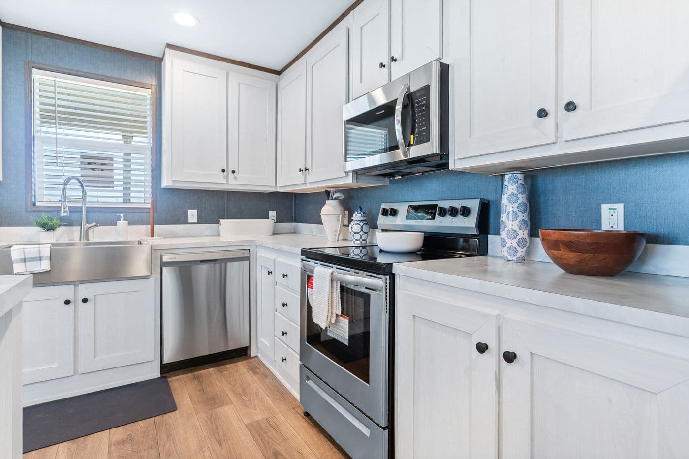 The RETREAT LIVING 16682A Kitchen. This Manufactured Mobile Home features 2 bedrooms and 2 baths.