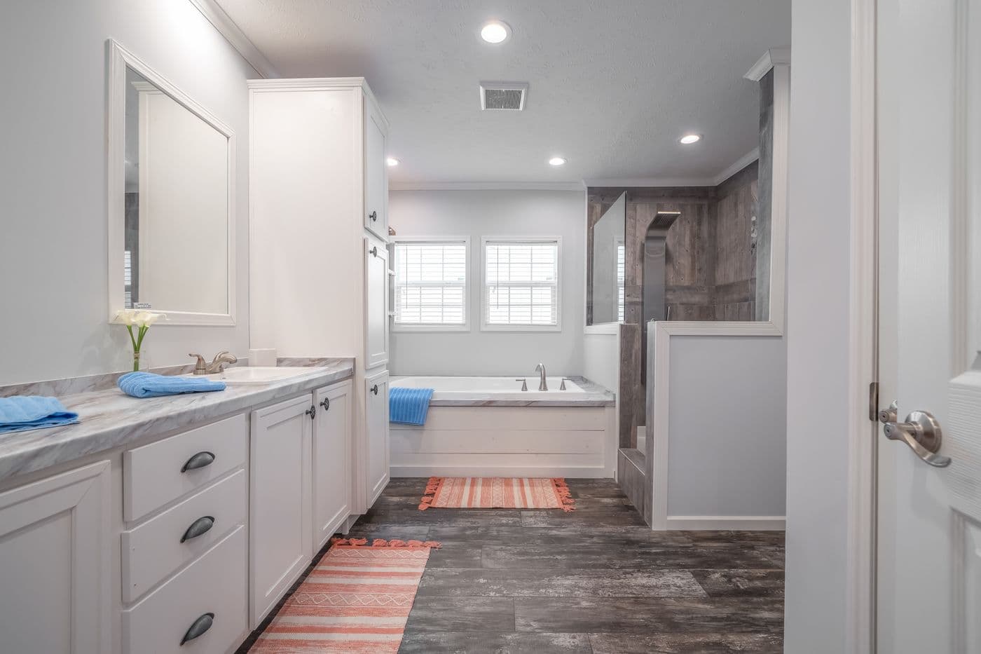 The THE HEWITT Primary Bathroom. This Manufactured Mobile Home features 4 bedrooms and 3 baths.
