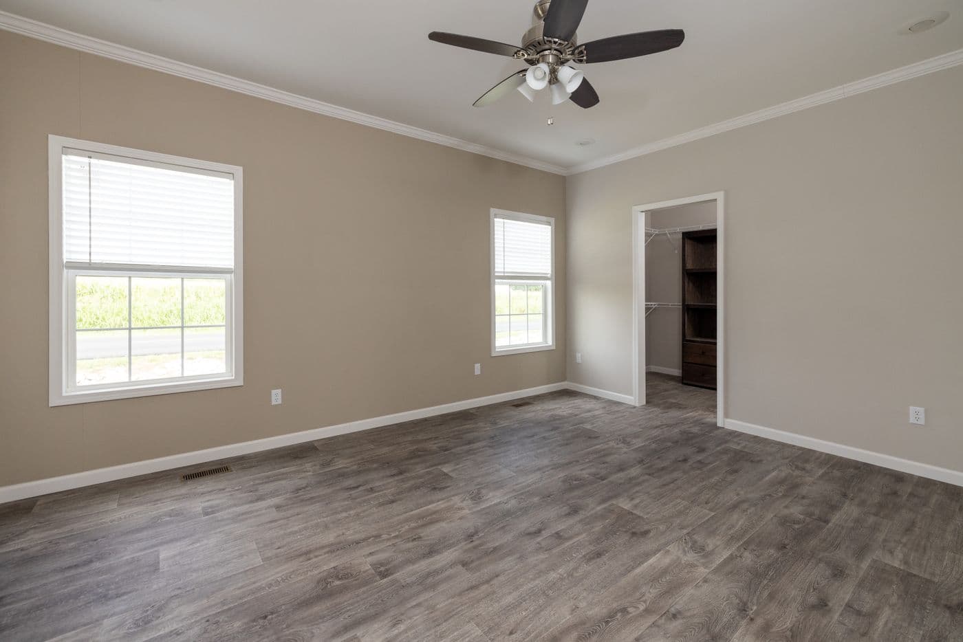 The THE ROGUE Primary Bedroom. This Manufactured Mobile Home features 3 bedrooms and 2 baths.