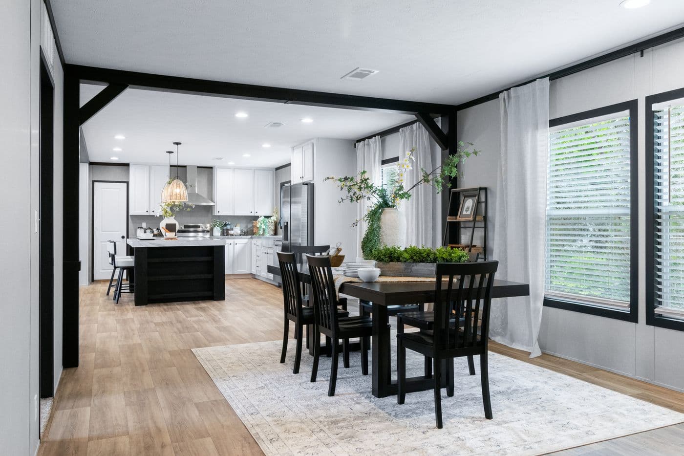 The ABSOLUTE VALUE Dining Area. This Manufactured Mobile Home features 4 bedrooms and 2 baths.
