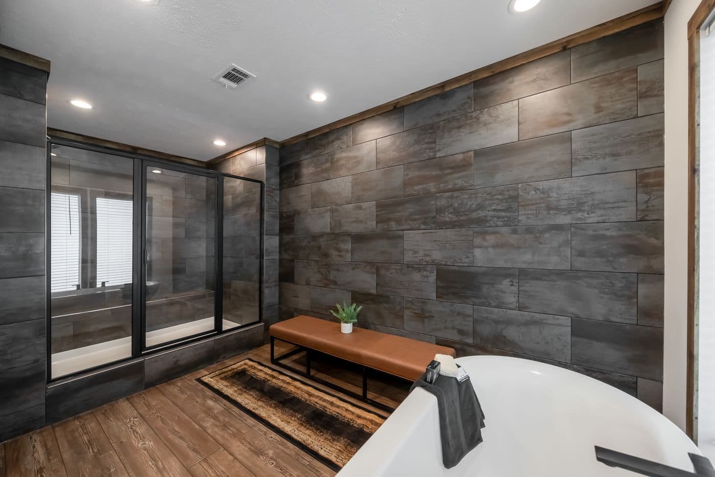 The THE MILL HOUSE Primary Bathroom. This Manufactured Mobile Home features 3 bedrooms and 2 baths.
