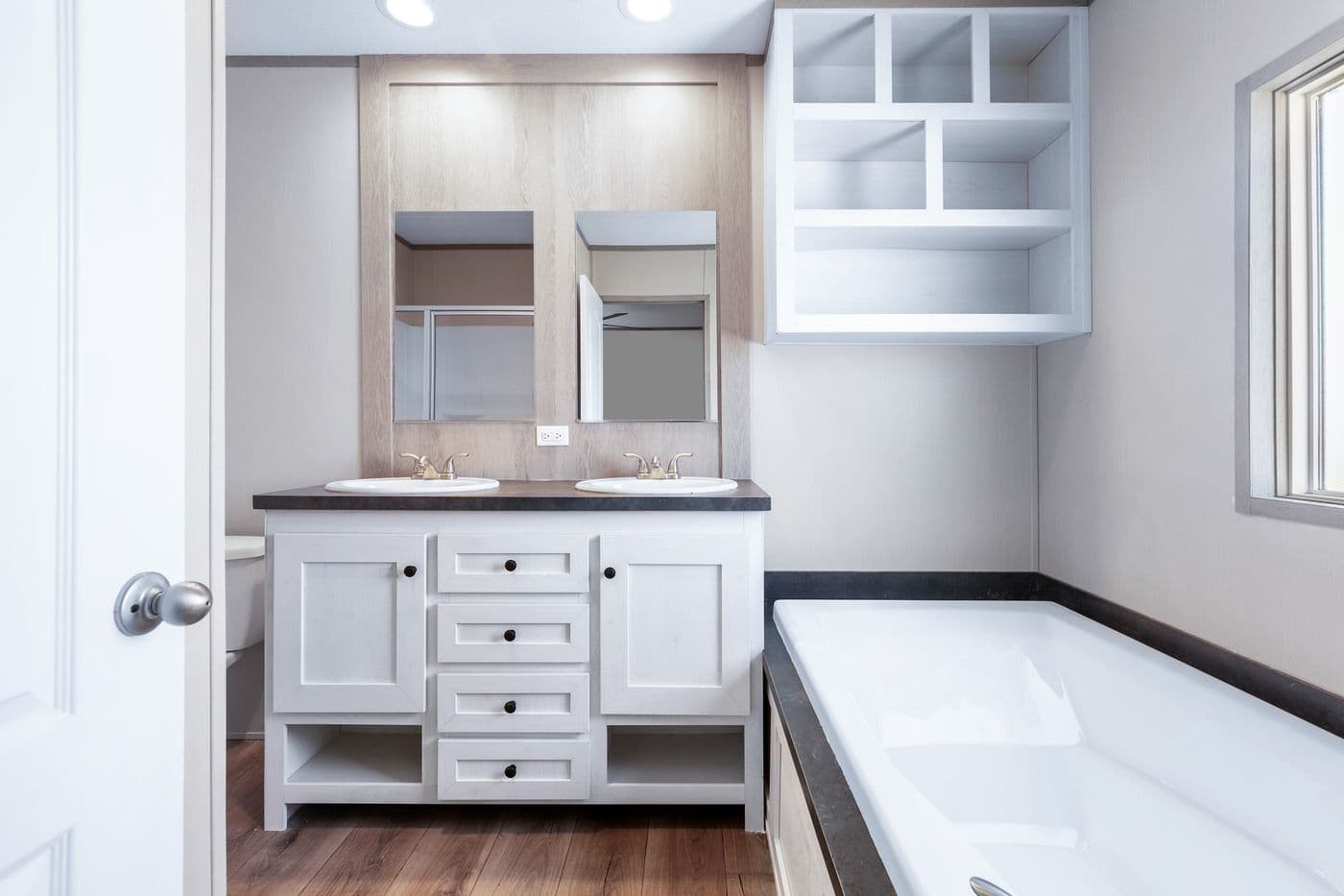 The ANNIVERSARY 16602A Primary Bathroom. This Manufactured Mobile Home features 2 bedrooms and 2 baths.