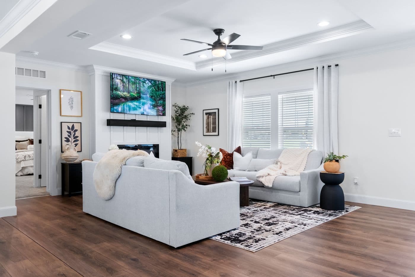 The THE IRON PEAK Living Room. This Manufactured Mobile Home features 4 bedrooms and 2 baths.