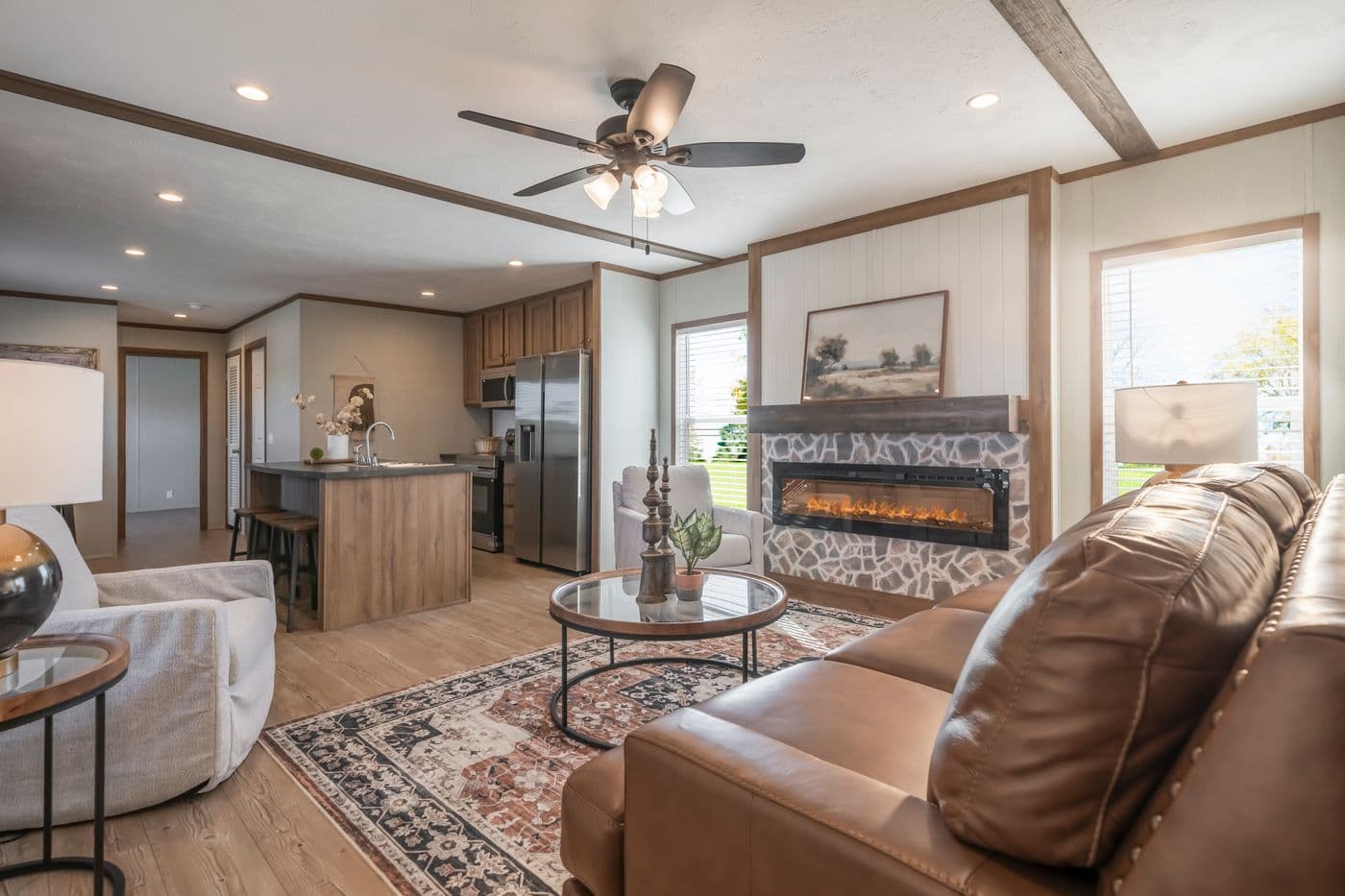 The SEAS THE DAY Living Room. This Manufactured Mobile Home features 3 bedrooms and 2 baths.