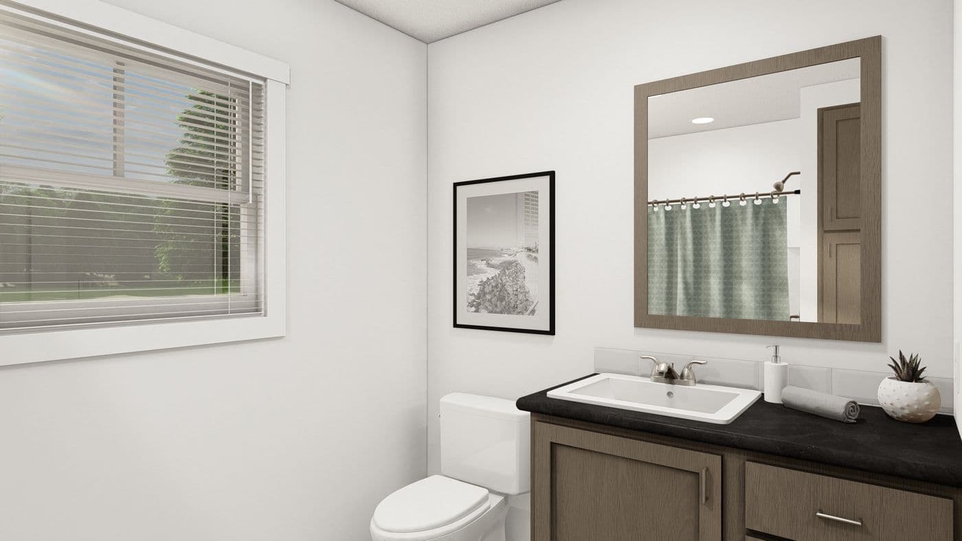 The THE WASHINGTON Guest Bathroom. This Manufactured Mobile Home features 3 bedrooms and 2 baths.