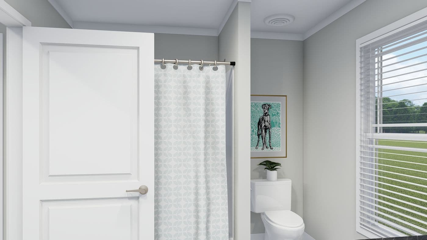 The THE BREEZE Guest Bathroom. This Manufactured Mobile Home features 3 bedrooms and 2 baths.