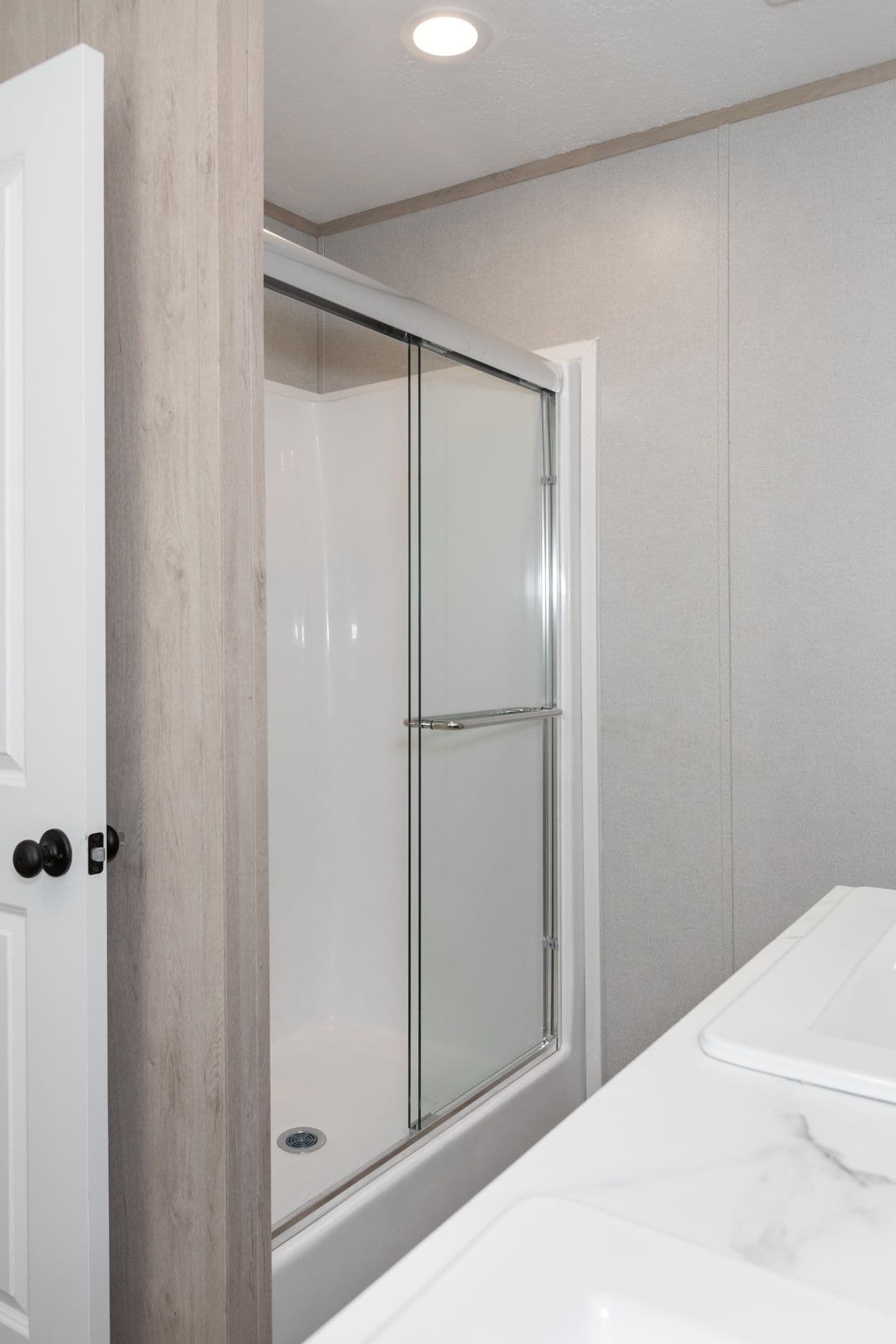 The THE ANNIVERSARY ISLANDER Primary Bathroom. This Manufactured Mobile Home features 3 bedrooms and 2 baths.