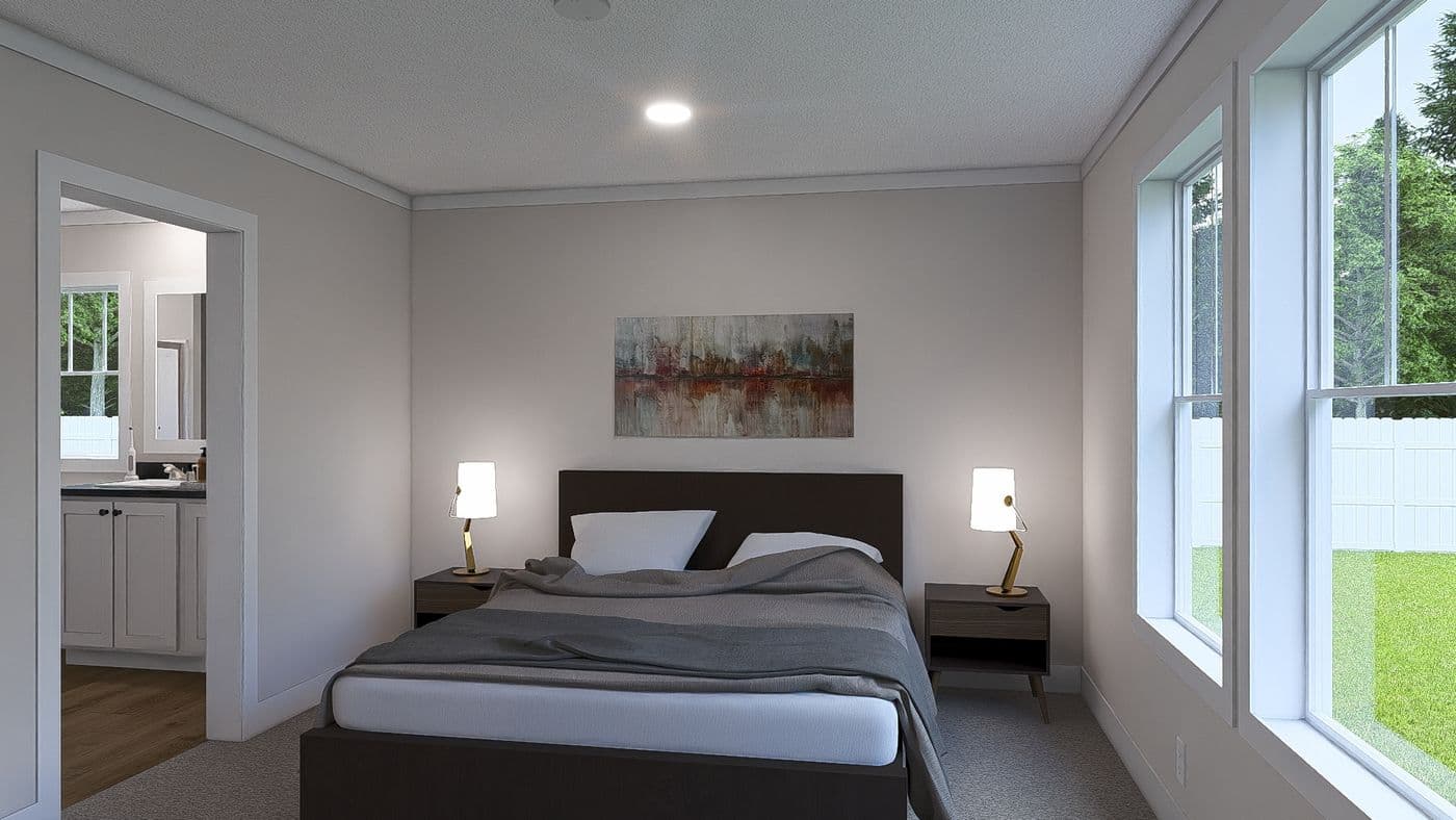 The WHOLE LOTTA LOVE Primary Bedroom. This Manufactured Mobile Home features 3 bedrooms and 2 baths.